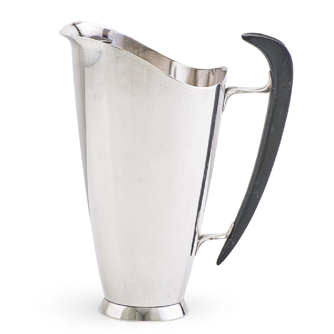 GORHAM STERLING SILVER MARTINI PITCHER: Ebonized wood handle, USA, 1958 Marked 8 1/2", 15.5 ozt (total weight) Note: This design is illustrated in Jewel Stern, Modernism in American Silver, 2005, fig. 3.20, p. 268.