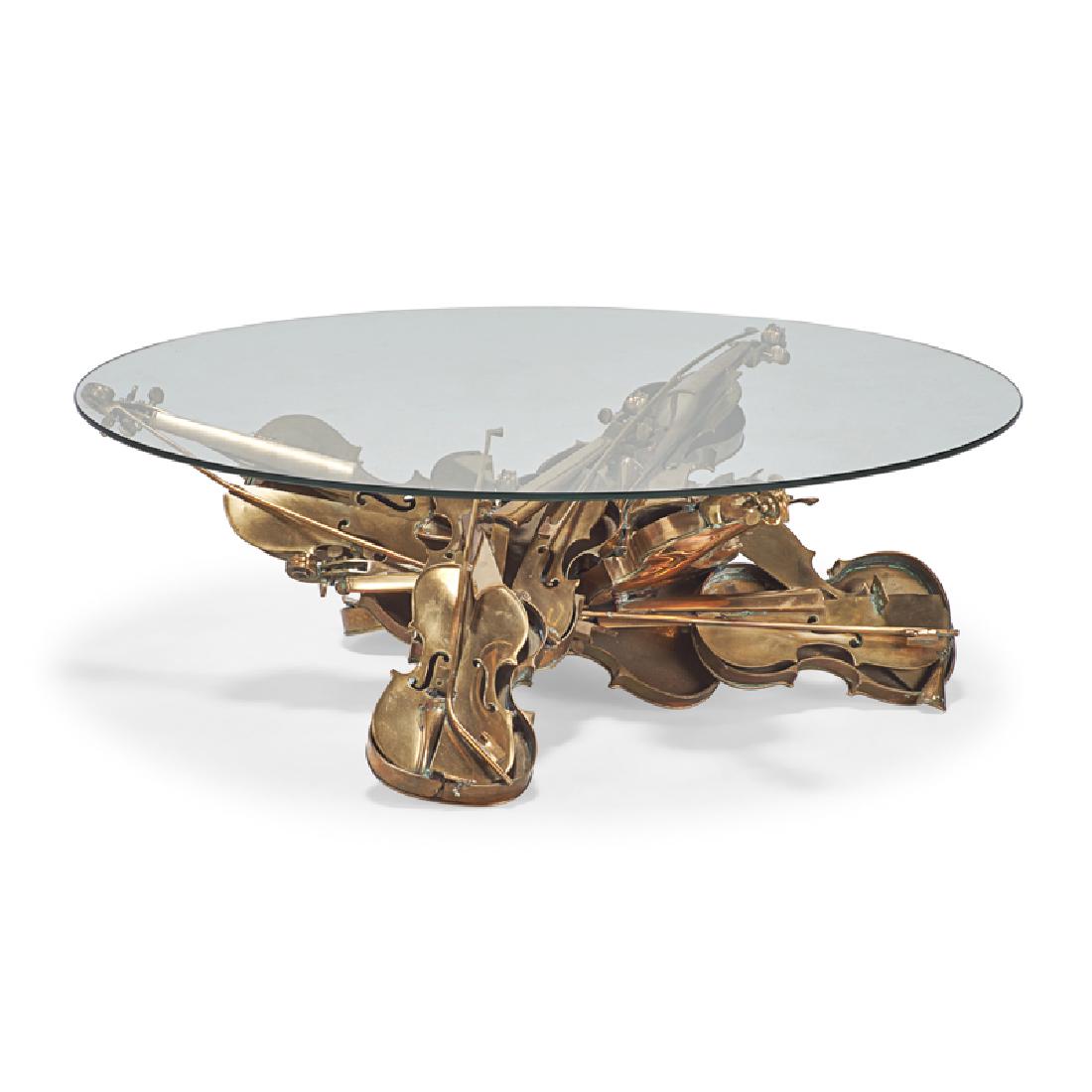 Arman (French/American, 1928-2005): Coffee Table, ca. 1990 Polished bronze and glass Incised signature 16" high x 48" diameter Provenance: Private Collection, New Jersey