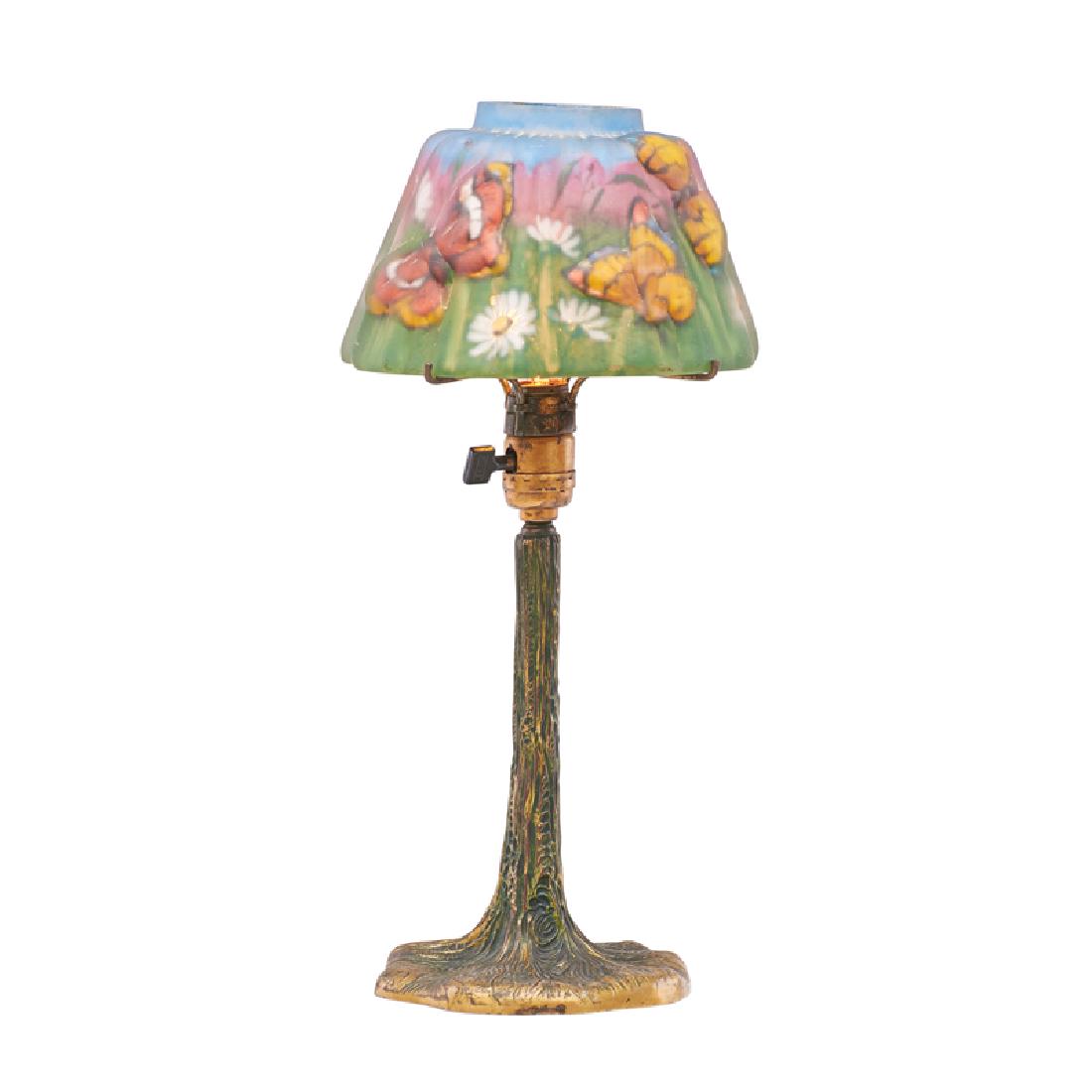 PAIRPOINT Puffy boudoir lamp: PAIRPOINT Puffy boudoir lamp, Balmoral shade with daisies and butterflies on tree trunk base, New Bedford, MA, 1910s-20s Reverse-painted frosted glass, patinated metal, single socket Base stamped PAIR