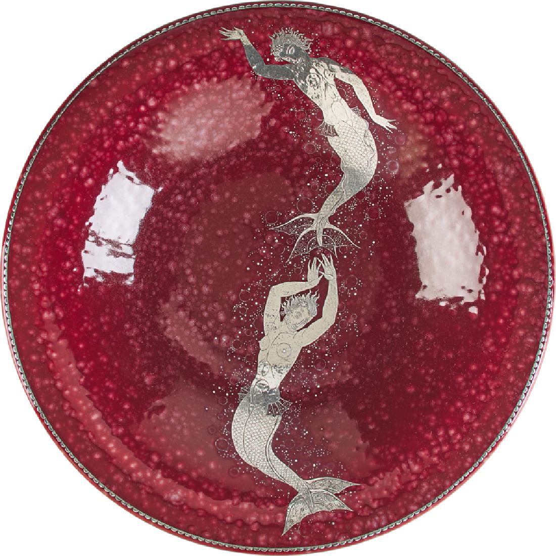 GUSTAVSBERG Large red Argenta charger w/ mermaids: WILHELM KAGE (1889 - 1960) GUSTAVSBERG Large red Argenta charger with two mermaids, Sweden, 1941 Glazed stoneware, silver inlay Silver signature GUSTAVSBERG K KAGE 1035 III with anchor/E.E.H. 2 3/4" x