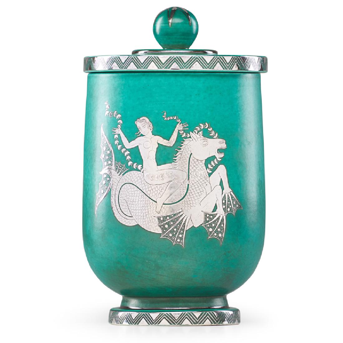 GUSTAVSBERG Argenta lidded vessel w/ seahorse: WILHELM KAGE (1889 - 1960) GUSTAVSBERG Argenta lidded vessel with nude riding a seahorse, Sweden, 1944 Glazed stoneware, silver inlay Manufacturer stamp/HANDDREJAD, inlaid signature RICKARD LINDSTROM