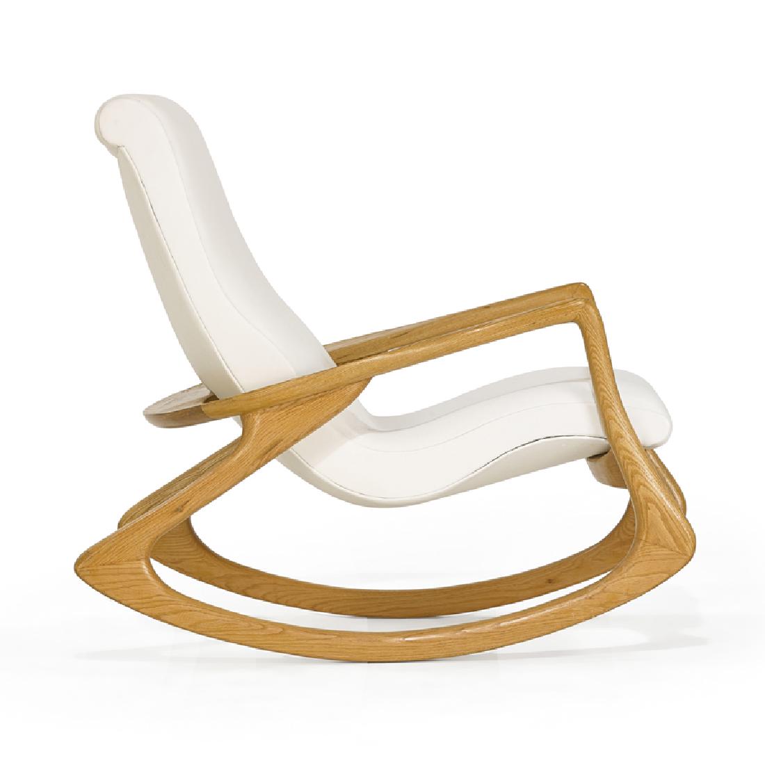 VLADIMIR KAGAN Contour rocking chair: VLADIMIR KAGAN (b. 1927) VLADIMIR KAGAN DESIGNS, INC. Contour rocking chair, New York, late 20th C. Sculpted oak, leather Unmarked 37" x 32 1/2" x 41"