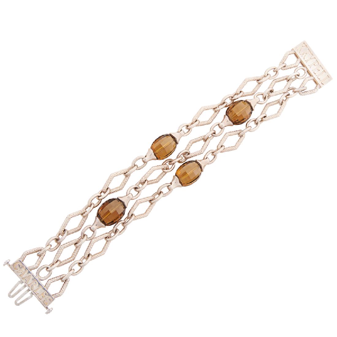CHARLES KRYPELL BROWN CITRINE & STERLING BRACELET: The three strands of textured navette links and bright jump rings with faceted citrine stations. Stamped by the maker. 7". 47.1 gs.