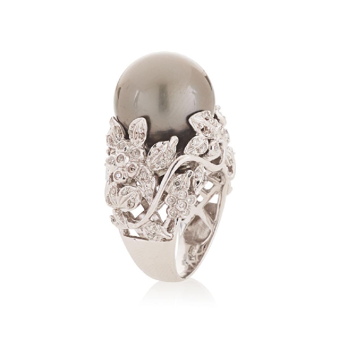 TAHITIAN BLACK SOUTH SEA PEARL & DIAMOND RING: The saltwater cultured pearl, 14.74 mm, within floral RBC diamond open form gallery, approx. .45 ct. TW. 14k. Size 5. 10.6 dwt.