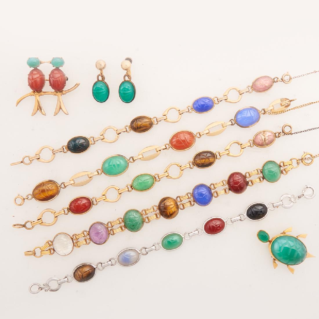 CARVED HARDSTONE JEWELRY: Comprising five scarab link bracelets in gold-filled or sterling; A pair of scarab and gold-filled drop earrings; Two turtle or birds gold-filled brooches.