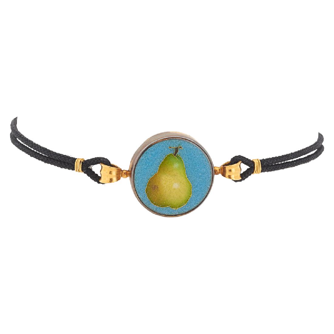 ENAMELED YELLOW GOLD PEAR CHOKER NECKLACE: An enameled green pear over blue ground, within gold bezel, on braided fabric cord, by Robert M Kulicke. 14k. Signed by the maker. 11". 10.0 dwt. GW. (supported).