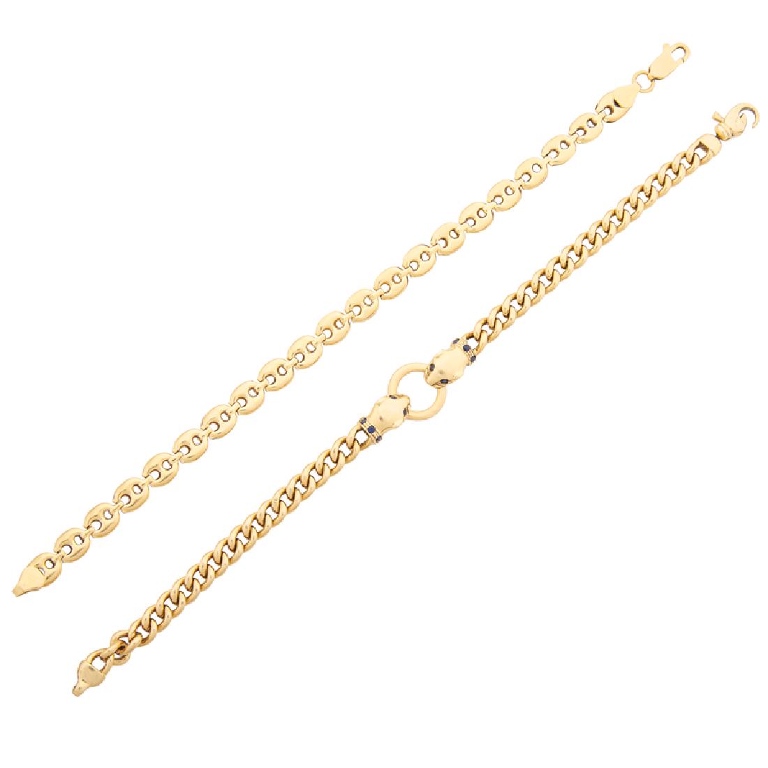 YELLOW GOLD LINK BRACELETS: A marine link bracelet; A cable link bracelet with confronted panther heads accented by round-faceted sapphires. 18k. Stamped Italy. 7". 10.5 dwt.