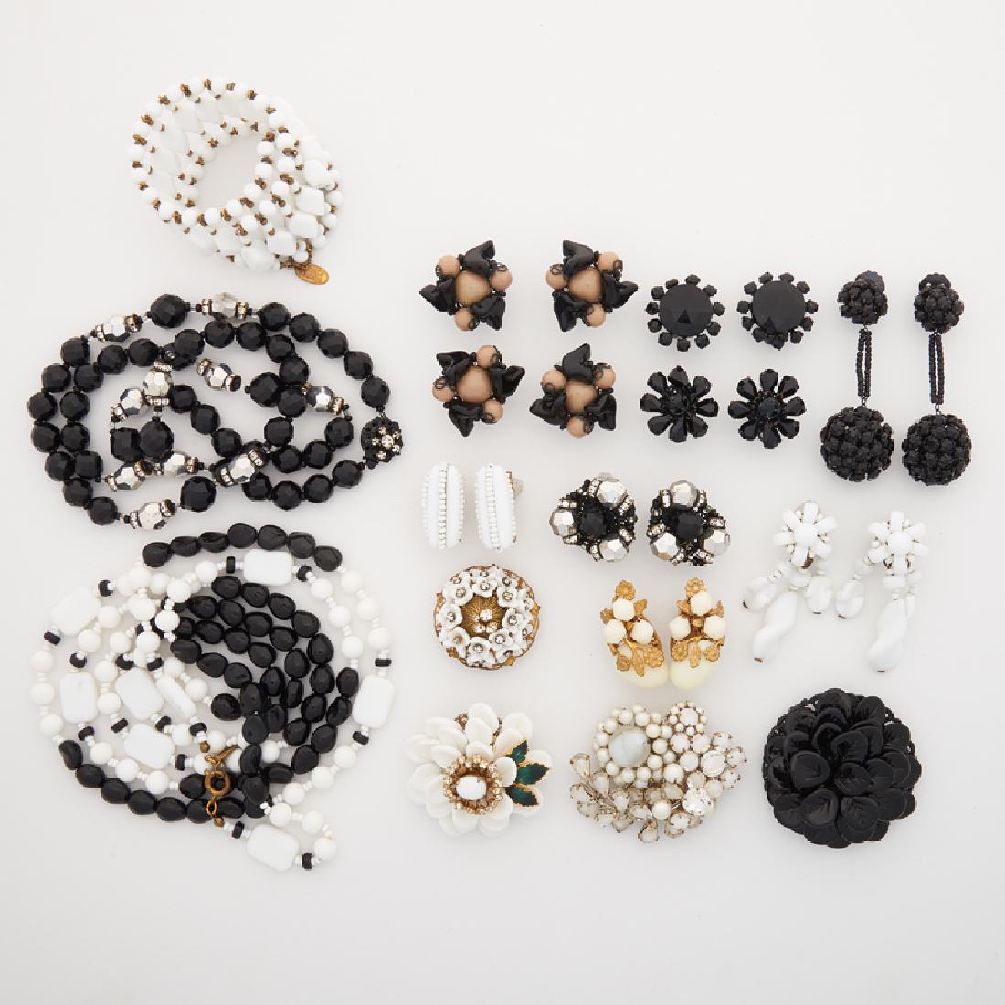 MIRIAM HASKELL COSTUME JEWELRY: Comprising an early faceted silvered or black faceted bead necklace and earring suite, ca. 1950; Three early floral brooches with glass petals or imitation pearls, ca. 1940-60; A beaded glass necklace