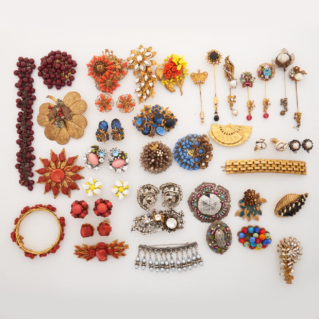 MIRIAM HASKELL COSTUME JEWELRY: Comprising nineteen brooches or clips; Seven stickpins; Nine pairs of earrings; Two bracelets; A hair clip. Pieces of note: A foliate two brooch, earring and bangle bracelet suite with coral glass; An