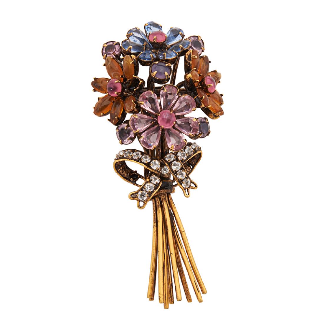 IRADJ MOINI BOUQUET BROOCH: The gilt-brass stemmed flowers with colorful glass petals, joined by a foil-backed glass ribbon bow. Stamped by the maker. 3 1/2" x 1 3/4".