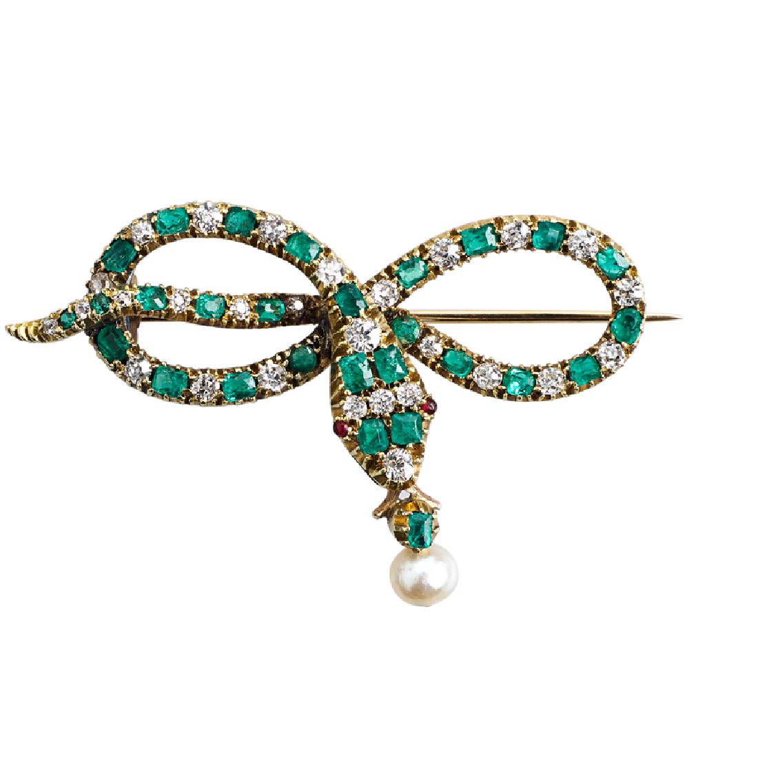 VICTORIAN DIAMOND & EMERALD SERPENTINE BROOCH: The OMC diamond, approx. 1.0 cts. TW. and emerald snake with ruby eyes coils to form a knot, suspending pearl drop. 14k. 1 1/8" x 1 3/4". 5.8 dwt. Provenance: From the Estate of Joanna Anderson.