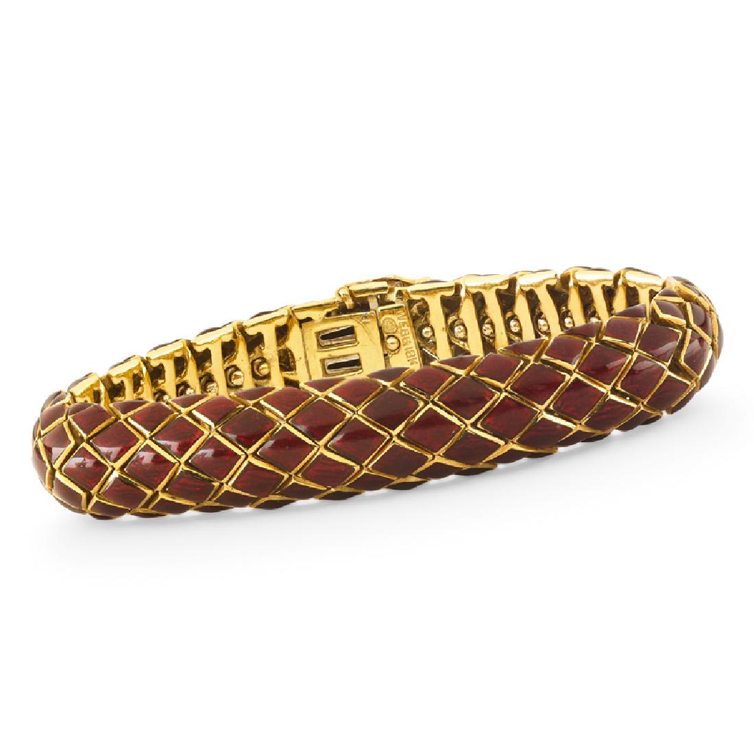 DAVID WEBB ENAMELED YELLOW GOLD SERPENT STRAP BRACELET: Designed as highly articulated conforming red guilloche enameled scales, trimmed in bright gold. 18k. Stamped by the maker. 6 1/2". 35.1 dwt. With original pouch.