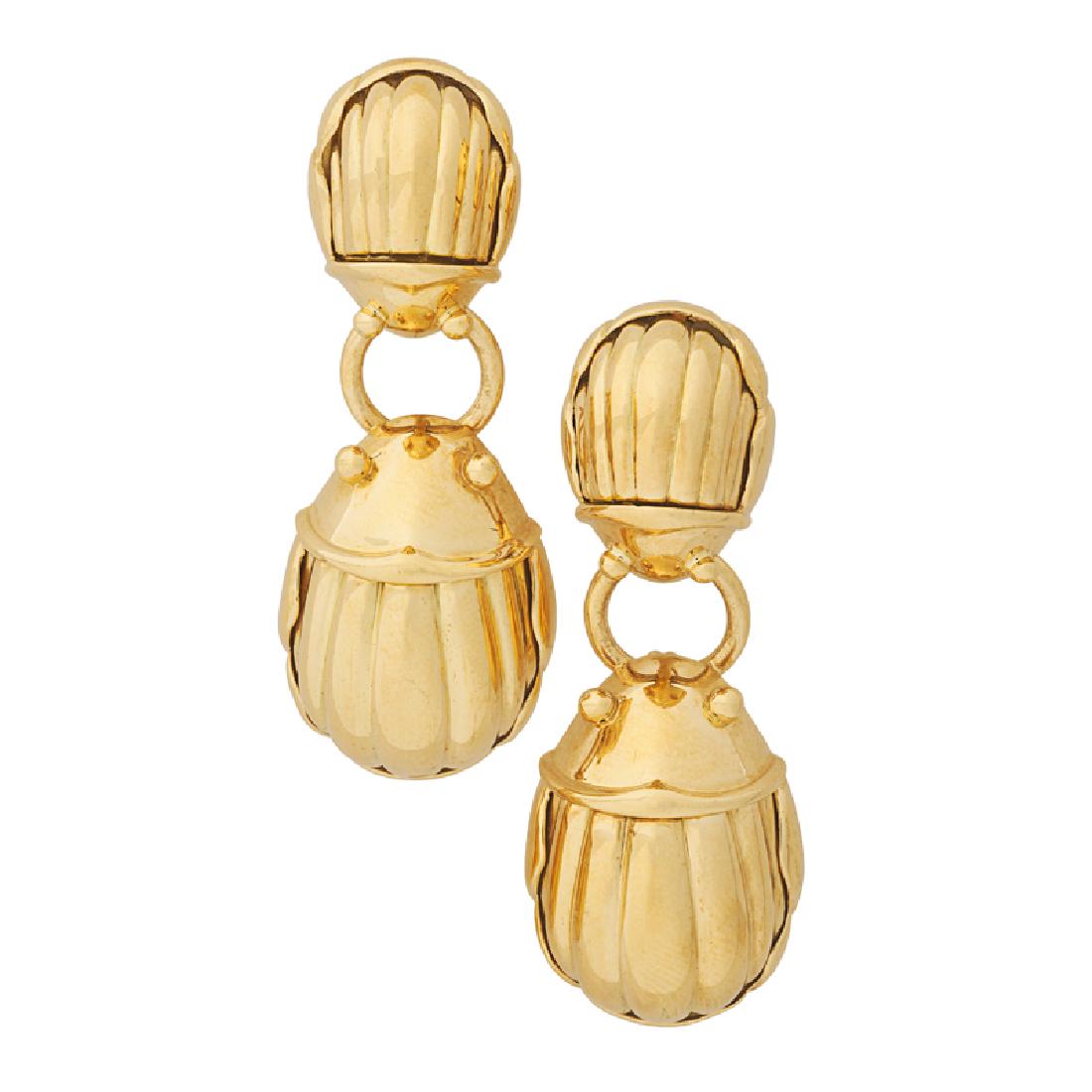TIFFANY & CO. YELLOW GOLD SCARAB DROP EARRINGS: Each a pair of confronted bright gold scarabs. 18k. Stamped by the maker, 1993. 1 1/2"". 15.5 dwt. With original pouch and packer.