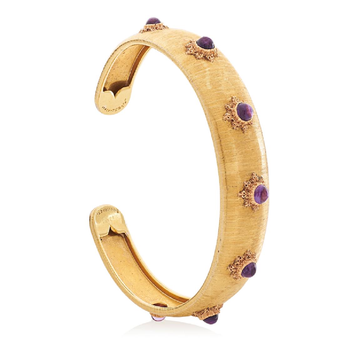 BUCCELLATI AMETHYST & YELLOW GOLD CUFF BRACELET: With round amethyst cabochons bezel-set within ornato engraved gold over rigato engraved ground. 18k. Signed by the maker, Italy. Accommodates 6 1/2". 16.2 dwt.