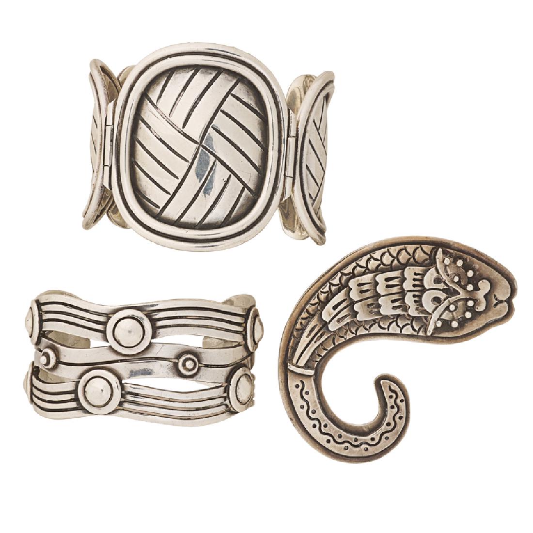 MEXICAN SILVER BRACELETS BROOCH, INCL WILLIAM SPRATLING: Comprising two Spratling "River of Life" or woven cuff bracelets; A Doric Corpus Artisans serpent brooch. 1940-1970. Stamped by the makers. Accommodates 6 1/2", accommodates 7", 2 3/4" x 2 1/2". 243.3