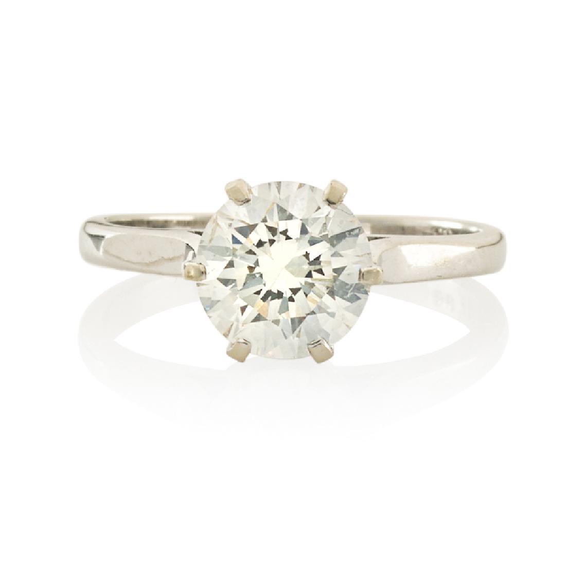 DIAMOND & WHITE GOLD SOLITAIRE ENGAGEMENT RING: With a six-prong-set RBC diamond, approx. 1.40 cts. by formula. 18k. Size 5 1/4. 1.7 dwt.