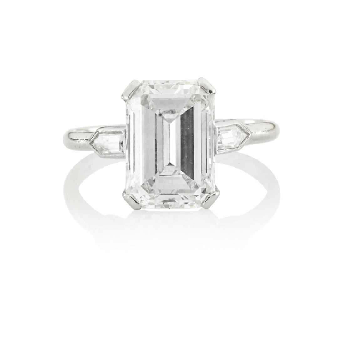 3.59 EMERALD-CUT DIAMOND ENGAGEMENT RING: With pentagonal-cut diamond shoulders, approx. .25 ct. TW., in platinum. Size 5 3/4. 2.6 dwt. Accompanied by GIA Report #5201161303, Dated 20 March 2019, 3.59 cts., Emerald Cut, 11.06 x 7.69 x 4.75 mm