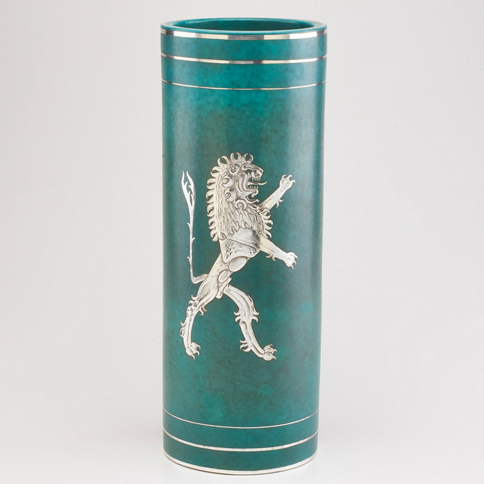 WILHELM KAGE (1889 - 1960); GUSTAVSBERG: Impressive Argenta cylindrical vase with central lion decoration, and tri-band detail, Sweden, 1932 Glazed earthenware, electroplated silver Marked GUSTAVSBERG/ARGENTA/A27 VI/MADE IN SWEDEN 15 1/2" x