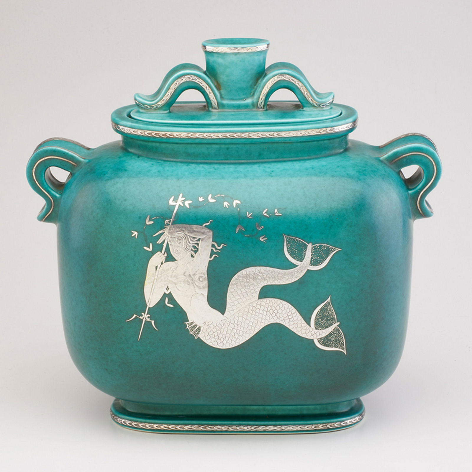 WILHELM KAGE (1889 - 1960); GUSTAVSBERG: Argenta covered jar, decorated with mermaid and marlin (reverse), Sweden, 1950 Glazed stoneware, electroplated silver Marked GUSTAVSBERG/KAGE/1140/17/40 11 1/4" x 11 3/4" x 6"