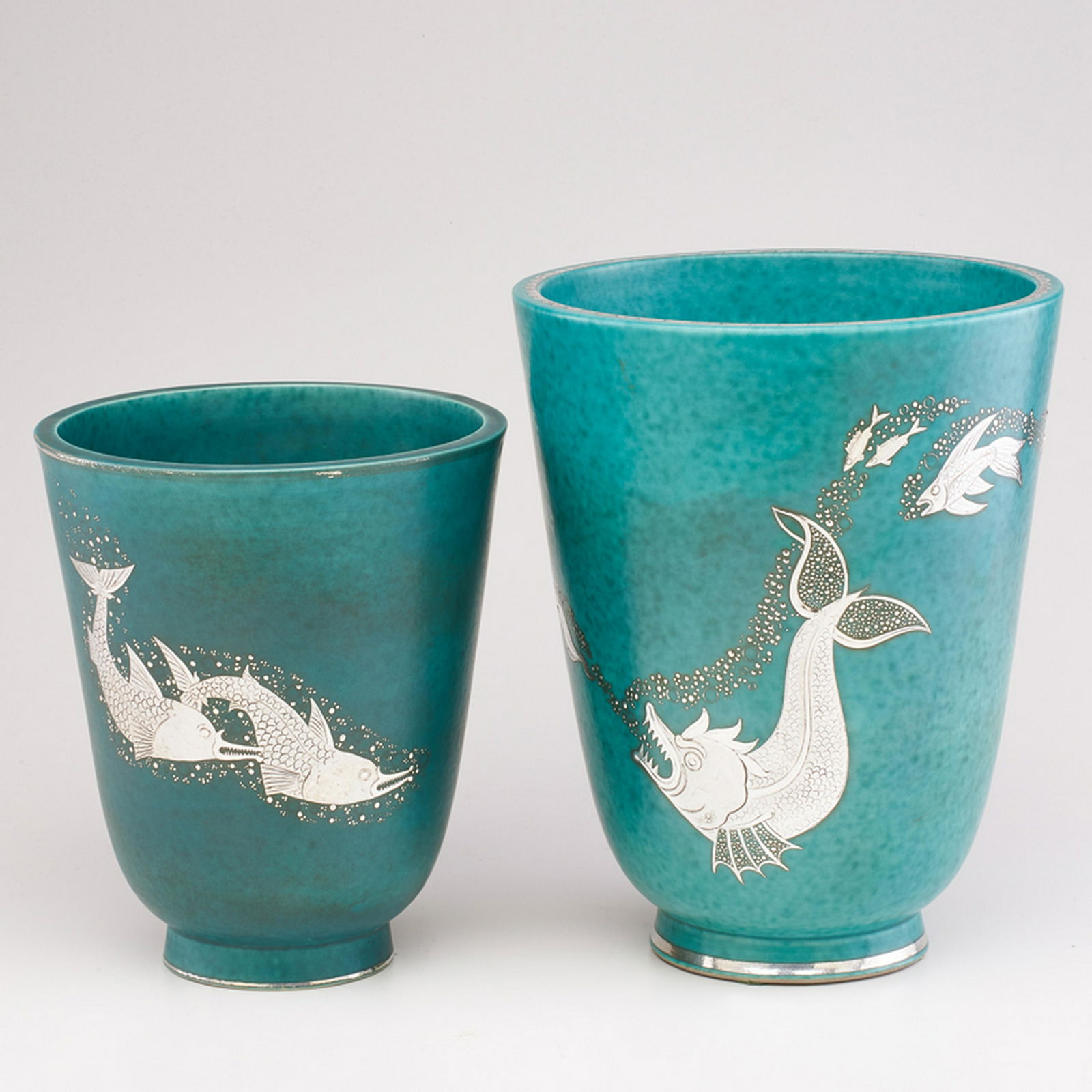 WILHELM KAGE (1889 - 1960); GUSTAVSBERG: Two Argenta flaring vases, decorated with predatory fish and Marlin, Sweden, 1932/1939 Glazed stoneware, electroplated silver Each marked GUSTAVSBERG/ARGENTA/978 III/MADE IN SWEDEN, GUSTAVSBERG/ARGENT