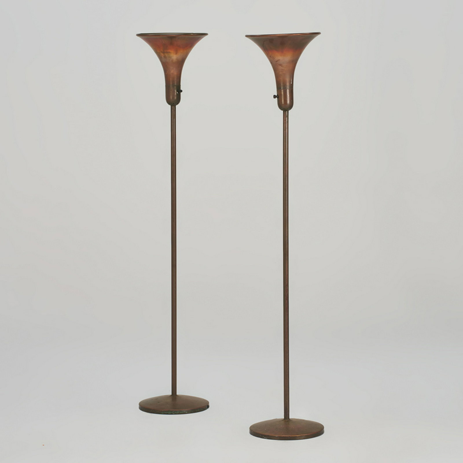 RUSSEL WRIGHT: Pair of torchere floor lamps, USA, ca. 1940s/50s Brass-plated metal Unmarked Each: 63" x 12" dia., shades: 12" dia.
