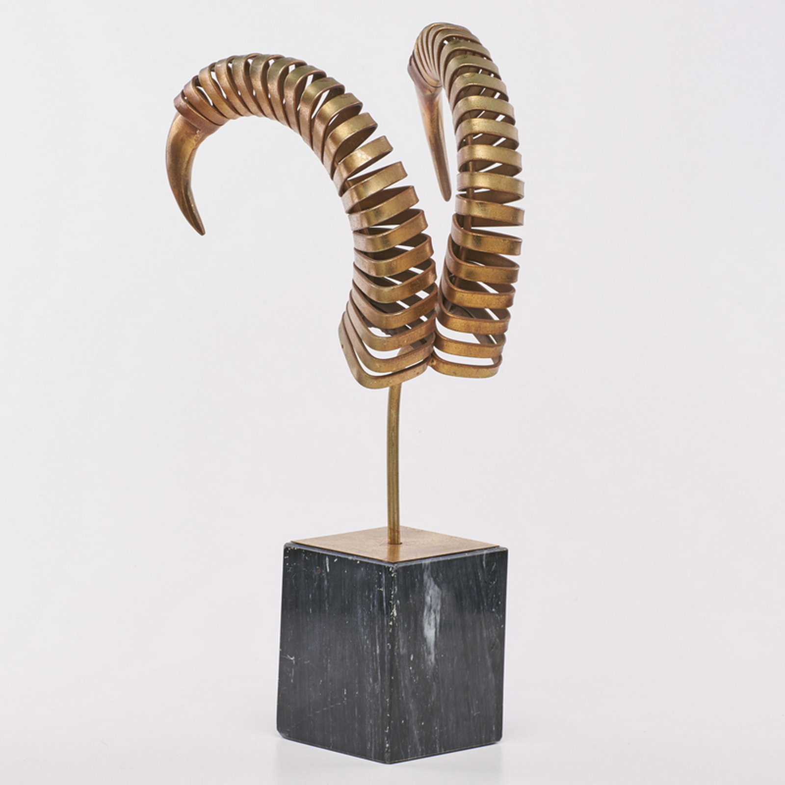 C. JERE; ARTISAN HOUSE: Ram's horns table top sculpture, Los Angeles, CA, 1983 Patinated bronze, marble Signed and dated 21 1/2" x 4 3/4" x 5"