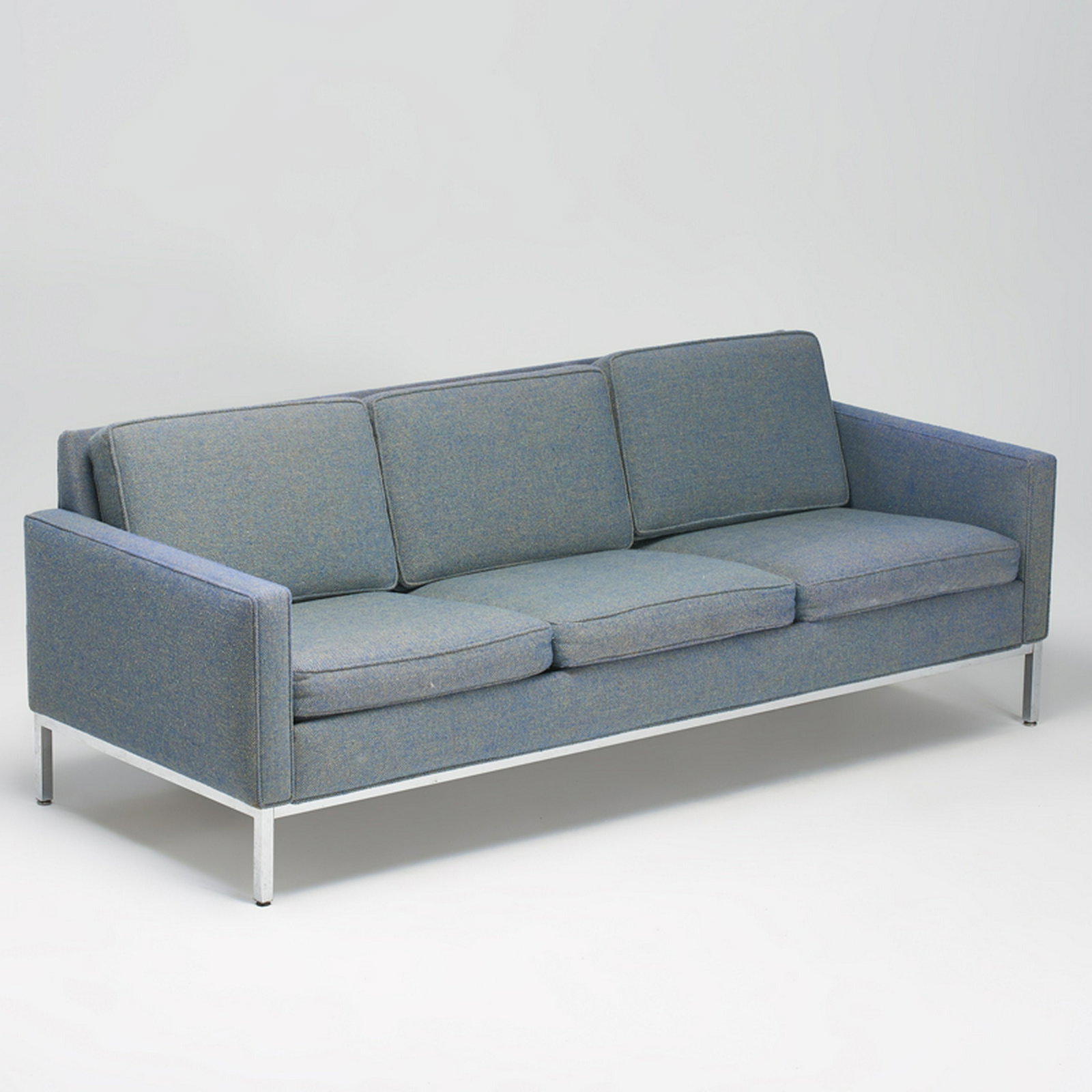 STYLE OF FLORENCE KNOLL: Steelcase sofa, USA, late-20th c. Chromed steel, upholstery Upholstery label 30" x 79" x 32"