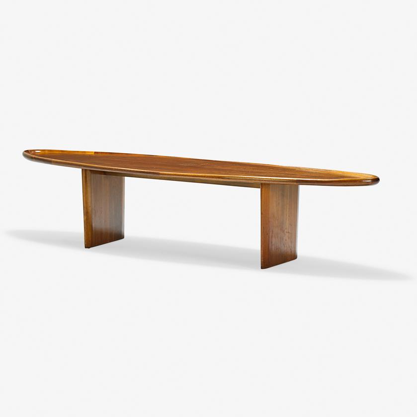 T.H. ROBSJOHN-GIBBINGS Coffee table: T.H. ROBSJOHN-GIBBINGS (1905 - 1976) WIDDICOMB Coffee table (no. 3304), Grand Rapids, MI, mid-20th C. Sculpted walnut Decal label, stenciled numbers 16" x 73" x 19"
