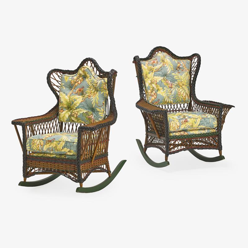 ASSOCIATED PAIR OF HEYWOOD WAKEFIELD (Attr.) RATTAN: ROCKER ARMCHAIRS Each with a tufted back and lattice work frame, one with a magazine holder, USA, ca. 1915 43" x 31 1/4" x 27" each