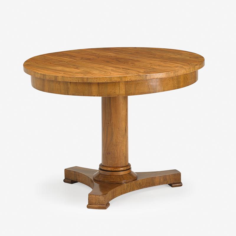 BIEDERMEIER STYLE WALNUT CENTER TABLE: Circular top on a tripod base, Austria, late 19th/early 20th c. 30 3/4"' x 40 1/2"