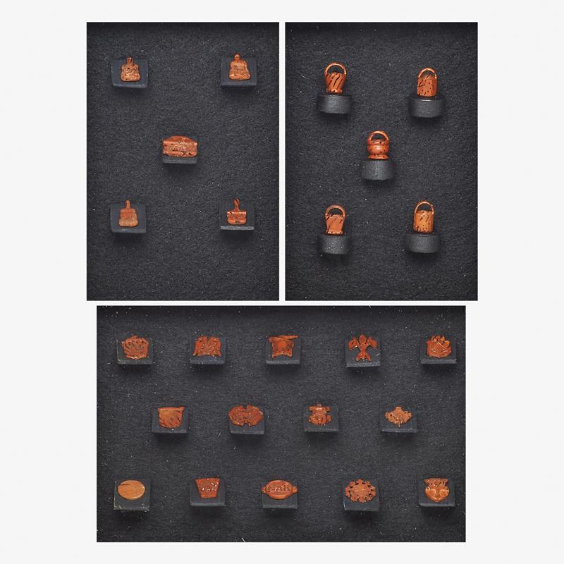 PROF. A.W. GIMBI, THE PA PEACH STONE CARVER: Three shadow boxes with carved peach stones: One with five in the form of baskets, one with five paint brushes, and one with fourteen insignia/emblems Shadowboxes 11" x 9" each, peach stones approxima