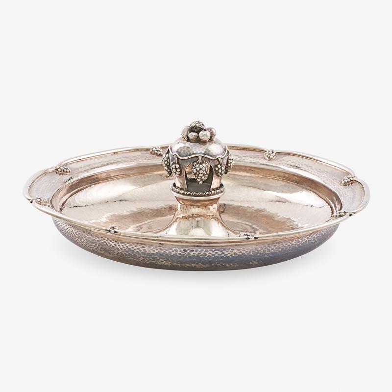 GEORGE V SILVER CENTERPIECE BOWL: In the Jensen taste, with applied grapes, by A.E. Jones, Birmingham, England, 1936 Marked 4" x 12 1/4", 34.7 ozt Provenance: L'Antiquaire, Palm Beach, 20 November 1989 Property from a Private Canadian