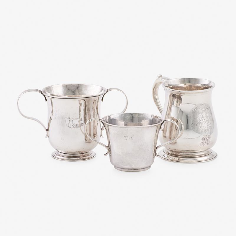 GEORGIAN SILVER DRINKING VESSELS: Three: A mug with engraved monograms by Edward Pocock, London, 1732, a two-handled cup by William Shaw & William Priest, London, 1758, and a two-handled cup, London, 1733 Marked Mug: 4 3/4", 25.1 ozt