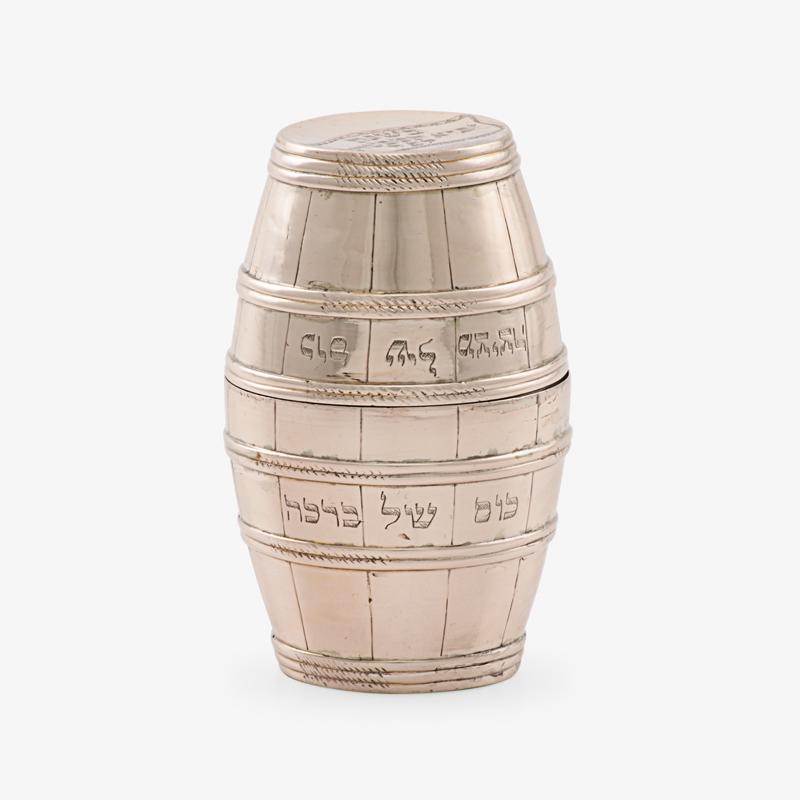 JUDAICA: A FINE GERMAN SILVER DOUBLE BEAKER FOR: CIRCUMCISION Set of flared, barrel-shaped beakers, on slightly raised round base, with identical decoration, gilt interiors. Both beakers inscribed in Hebrew on body, the one: "kos shel Metsitsah" cup