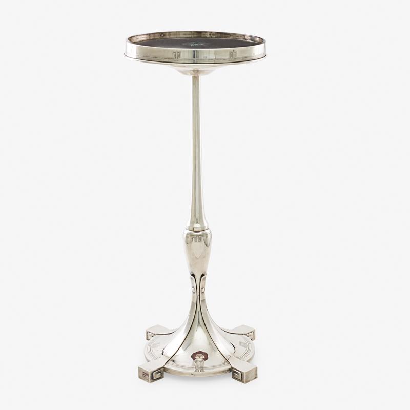 AMERICAN ART DECO SILVER TEA TABLE: Silver base with wood and glass top by the Merrill Shops, USA, ca. 1930 Marked 27" x 11" dia Provenance: L'Antiquaire, Palm Beach, 9 April 1984 Property from a Private Canadian Collection