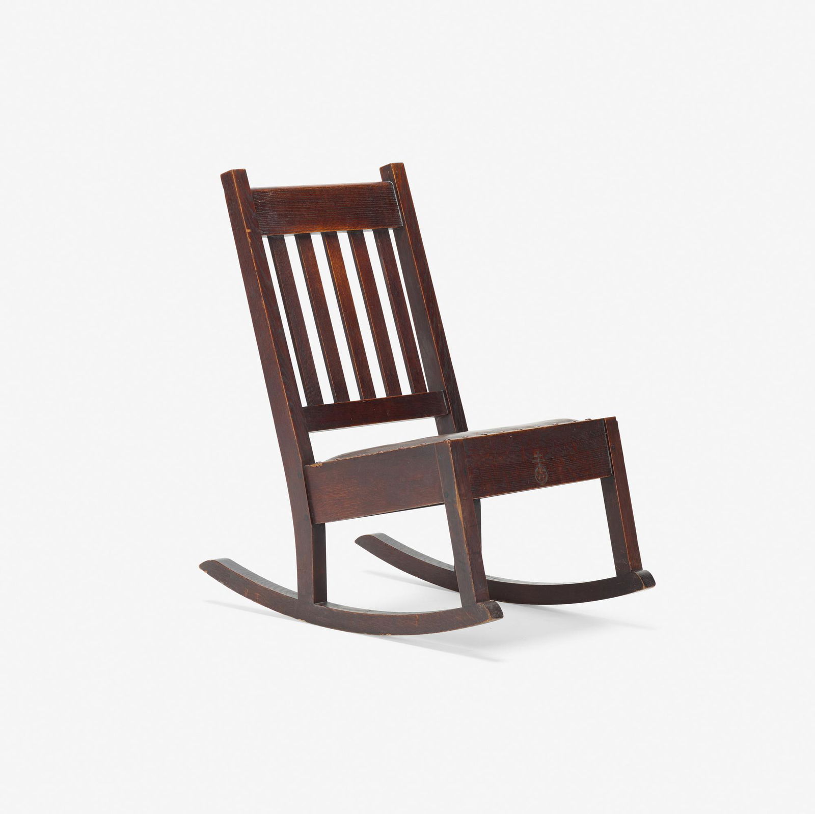 Roycroft, sewing rocker, model 39a: Roycroft sewing rocker, model 39a USA, c. 1906oak, Japan leather, metal tacks34 h × 19 w × 31 d in (86 × 48 × 79 cm) Carved orb and cross mark to front of seat.