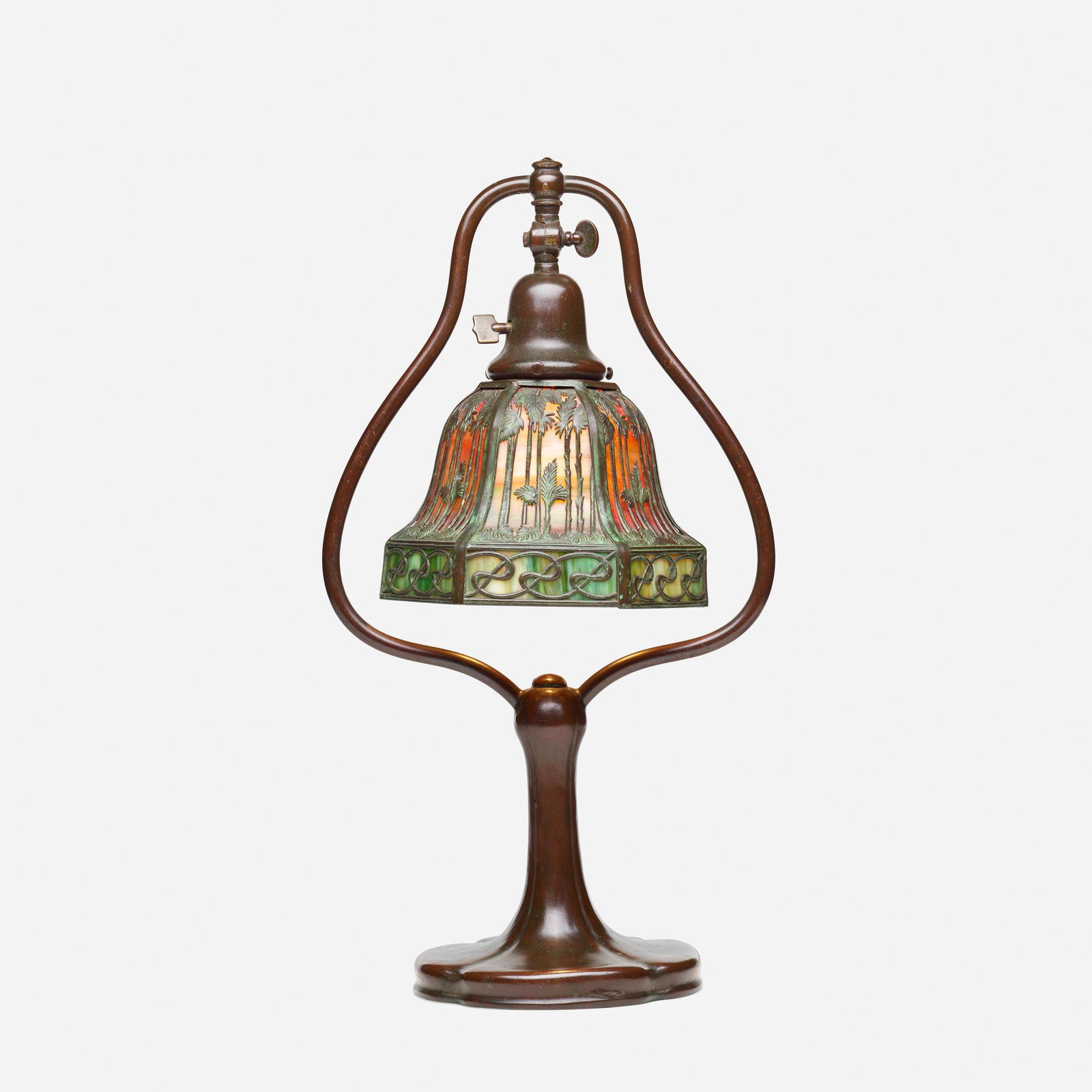 Handel, tropical palm overlay desk lamp: Handel tropical palm overlay desk lamp USA, c. 1915 patinated metal, "red sunset" glass, slag glass 18.5 h × 10 w × 6.25 d in (47 × 25 × 16 cm) Impressed manufacturer's mark