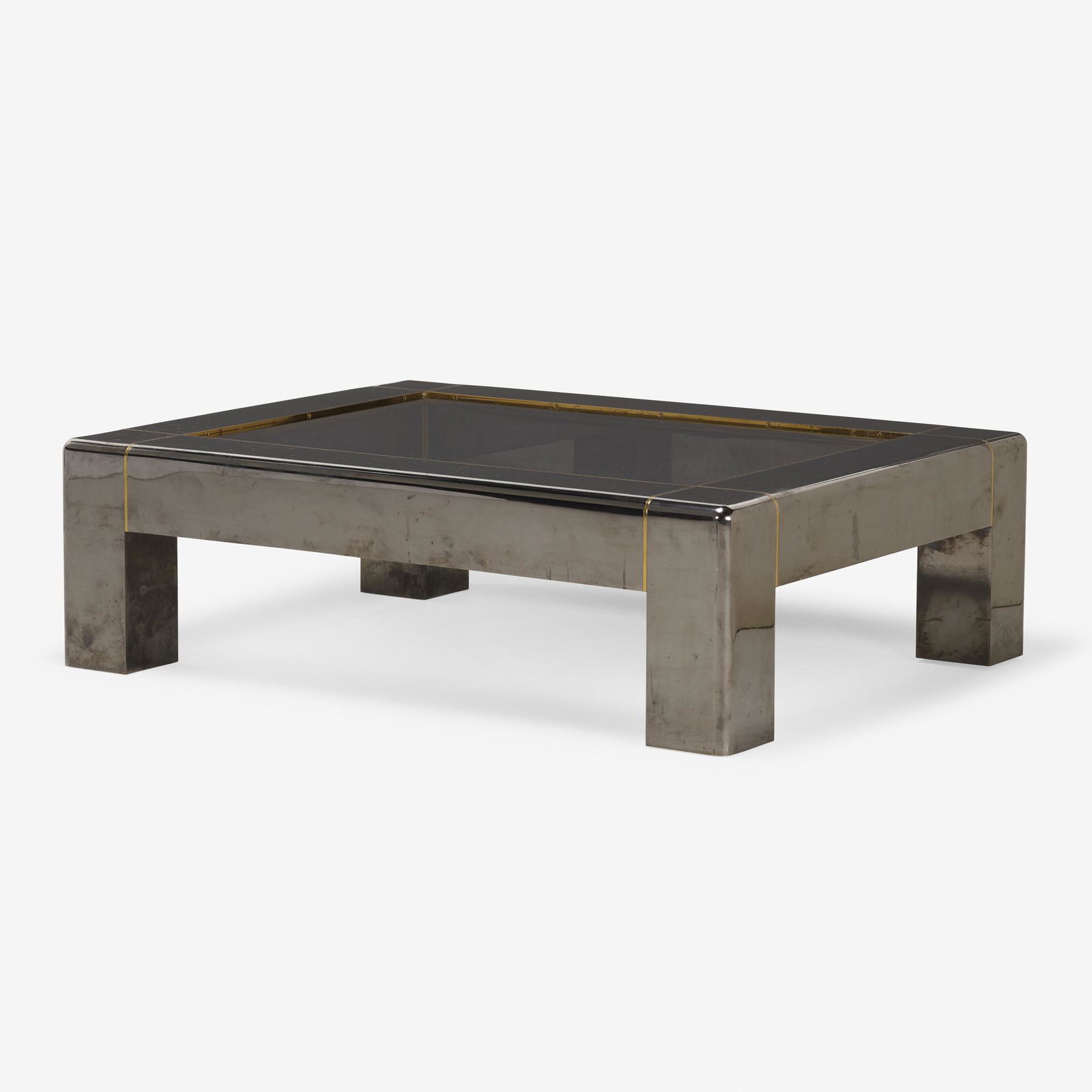 Karl Springer, Heavy Parsons Style coffee table: Karl Springer Heavy Parsons Style coffee table Karl Springer, Ltd.USA, c. 1983chrome-plated steel, brass, smoked glass16.25 h × 54 w × 41.5 d in (41 × 137 × 105 cm)