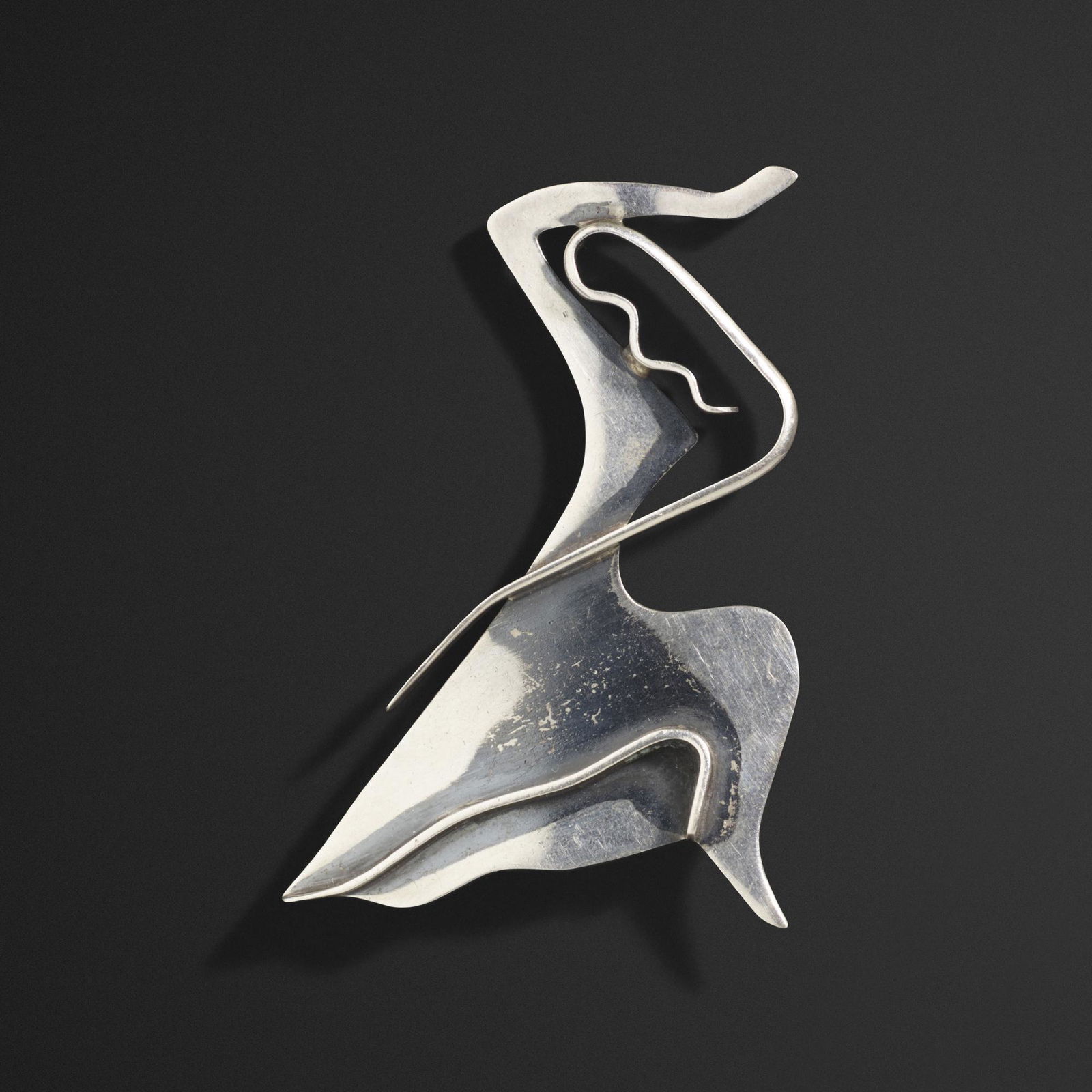 Ed Wiener, Dancer brooch: Ed Wiener Dancer brooch USA, 1947-48sterling silver3 h × 2.25 w × 0.5 d in (8 × 6 × 1 cm) Signed to reverse 'Ed Wiener Sterling'. This brooch was modeled after dancer and