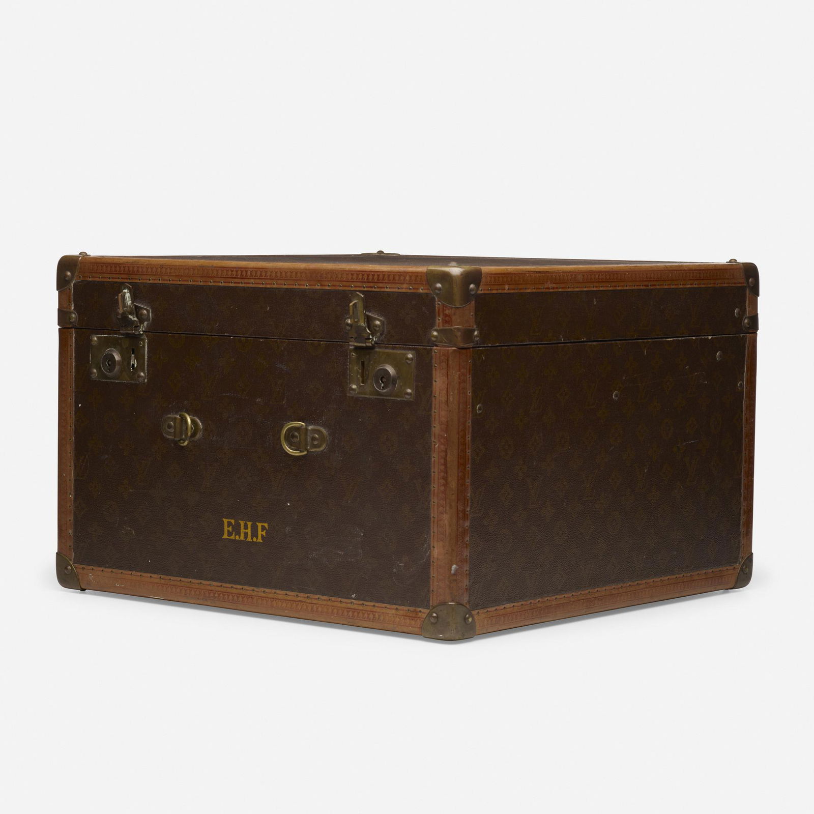 Louis Vuitton, shoe and hat trunk: Louis Vuitton shoe and hat trunk France, c. 1925leather, brass, canvas12 h × 18.5 w × 18.5 d in (30 × 47 × 47 cm) Monogram to exterior 'E.H.F.'. Decal retailer's label 'Bo