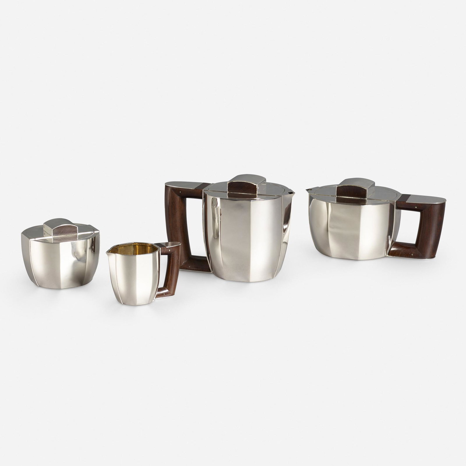 Jean-Emile Puiforcat, coffee and tea service: Jean-Emile Puiforcat coffee and tea service Ateliers Puiforcat France sterling silver, rosewood 5.5 h × 7.5 w × 4.5 d in (14 × 19 × 11 cm) Service is comprised of a coffee pot, teapot, sugar b