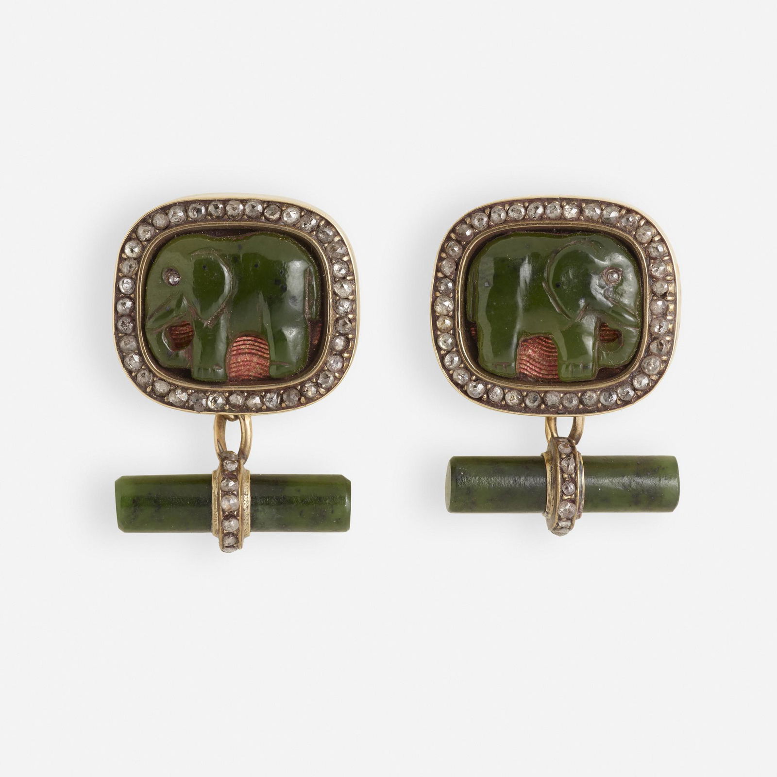 Russian, Antique elephant cufflinks: Russian Antique elephant cufflinks Of carved jade and rose-cut diamonds 14k yellow gold 3/4 x 1 1/8 ins; Gross weight 10.7 dwts