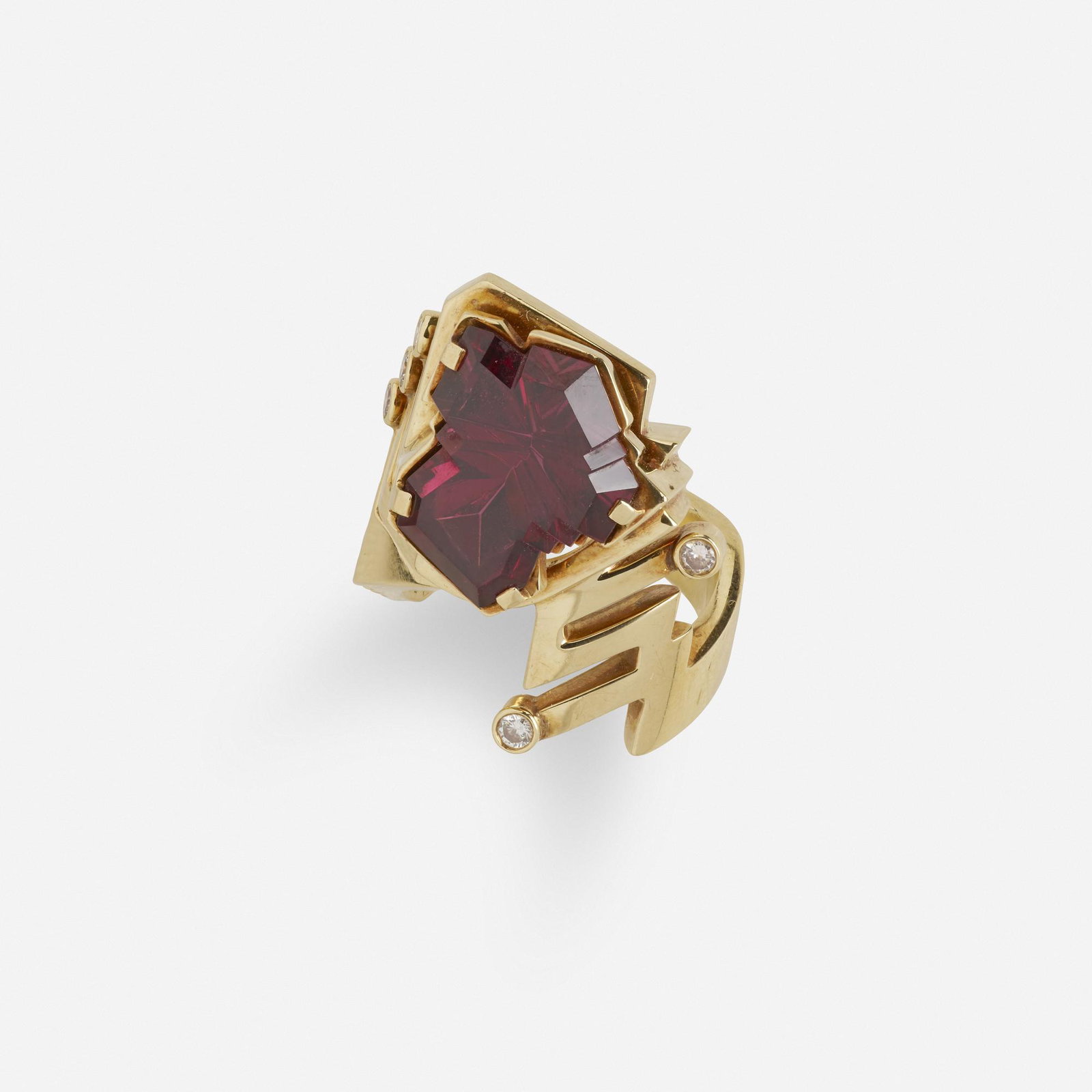 Alan Giovannetti, Garnet, diamond, and gold ring: Alan Giovannetti Garnet, diamond, and gold ring Set with a fancy-cut garnet with round diamond accents 18k yellow gold Signed A. Gio Ring size 7 1/4; Gross weight 15.8 dwts