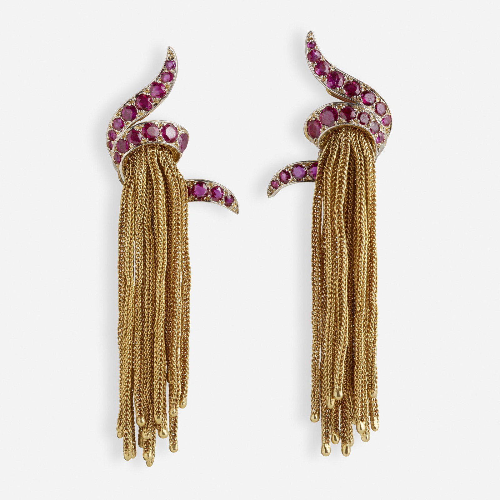 Cartier, Mid-Century gold and ruby fringe earrings: Cartier Mid-Century gold and ruby fringe earrings Set with circular-cut rubies in a swirling pattern, suspending gold fringe Yellow gold Signed Cartier 3/4 x 2 1/2 ins; Gross weight 15.8 dwts