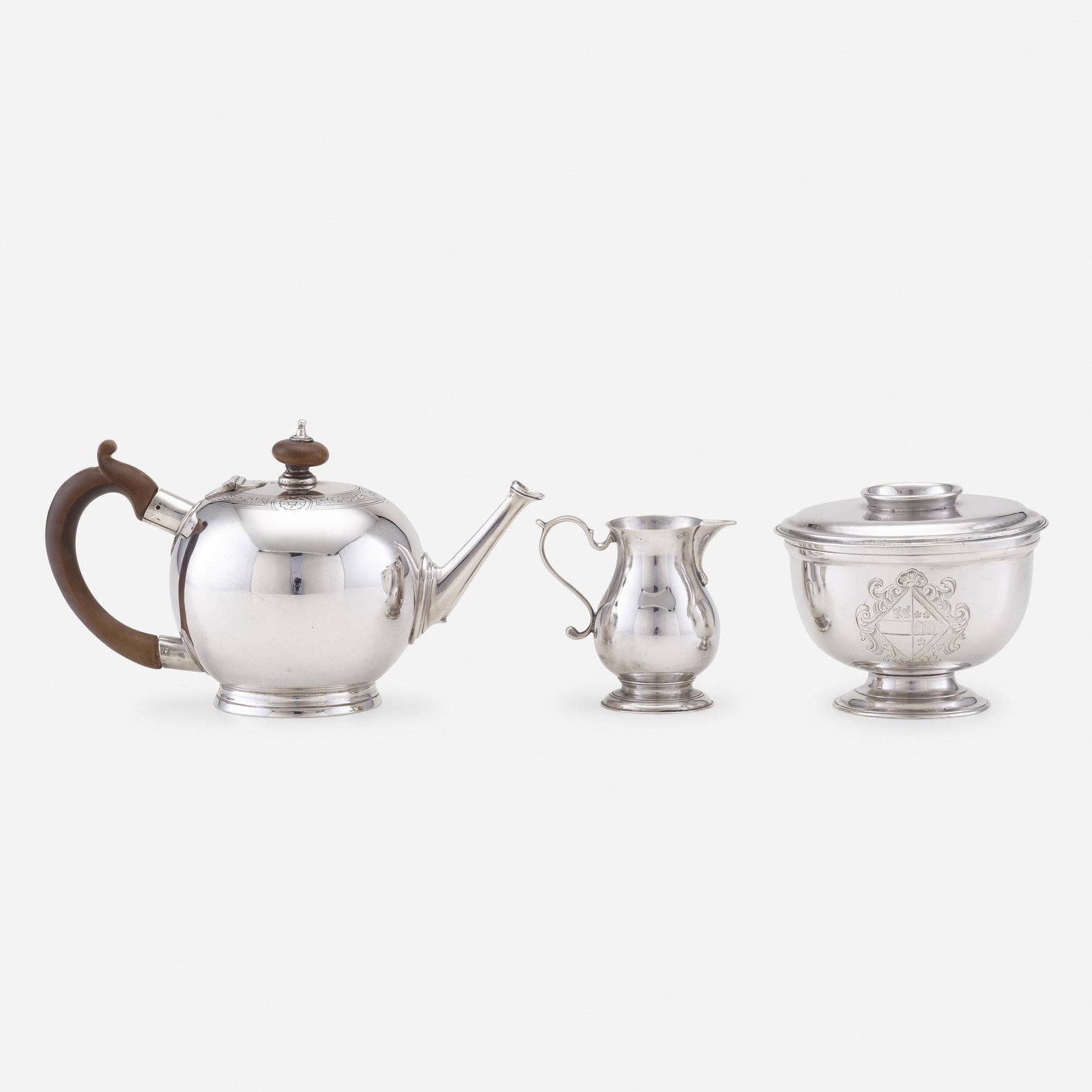 George II/III teawares, collection of three: George II/III teawares, collection of three London, England, 1740-71 sterling silver, wood 4.25 h × 8 w × 4 d in (11 × 20 × 10 cm) Teapot by David and Robert Hennel, 1771 Cream