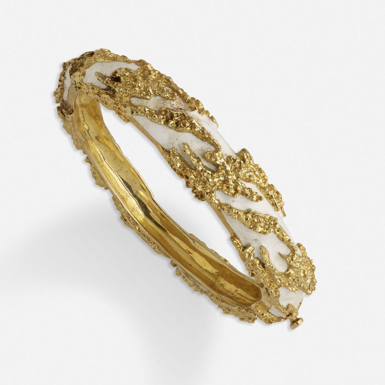 Jack Gutschneider, White enamel and gold bracelet: Jack Gutschneider White enamel and gold bracelet The tapered band of organically shaped textured gold and white enamel 14k yellow gold Signed JG JLRY Inner circ. 6 ins; Gross weight 39.2 dwts