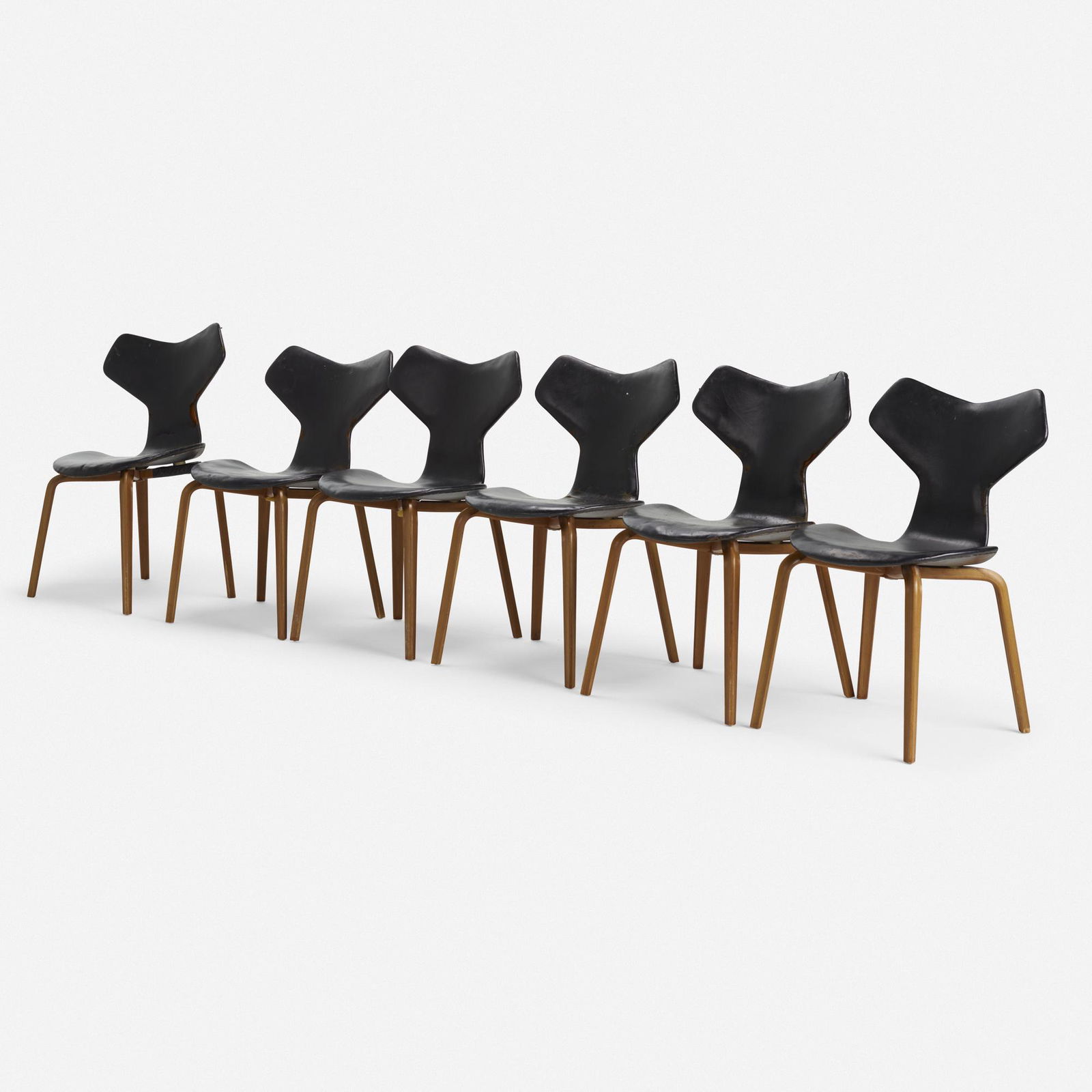Arne Jacobsen, Grand Prix chairs model 4130, set of six: Arne Jacobsen Grand Prix chairs model 4130, set of six Fritz HansenDenmark, 1957teak plywood, leather31 h × 18.5 w × 19.5 d in (79 × 47 × 50 cm) Fabric manufacturer'