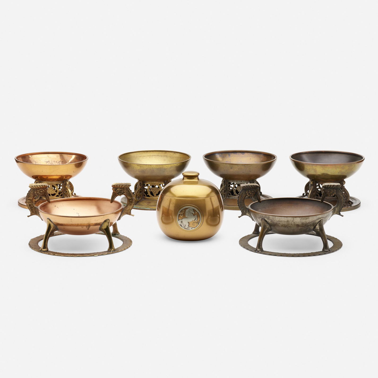 Oscar Bach, ashtrays, set of six: Oscar Bach ashtrays, set of six USA, c. 1925bronze, copper5.5 h × 9.5 dia in (14 × 24 cm) Sold with a Silvercrest humidor. Metal manufacturer's label to underside of each ashtray 'Osc