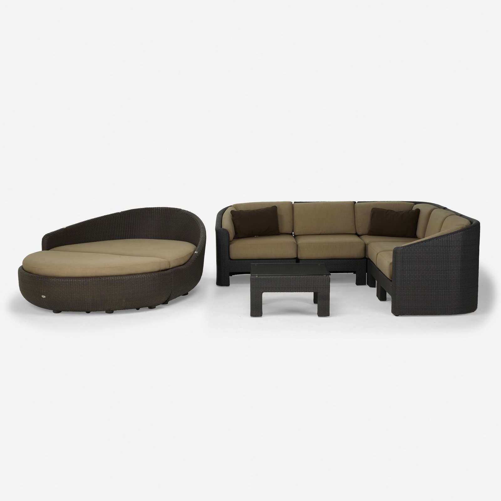 Gloster Furniture, outdoor furniture: Gloster Furniture outdoor furniture USA, c. 2000 resin wicker, glass, upholstery Sectional sofa assembled measures: 34 h x 96.5 w x 96.5 d inches. Coffee table measures: 15.5 h x 28.5 w x 28.5 d inche