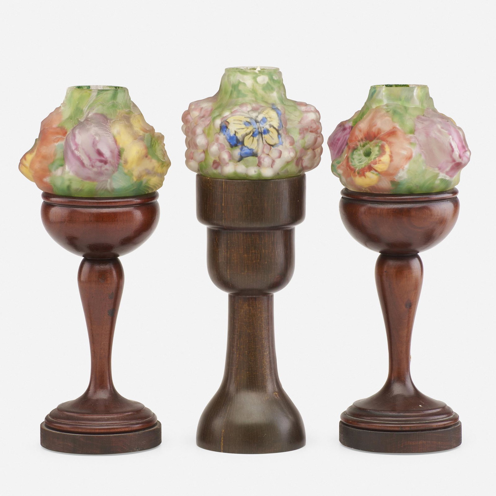 Pairpoint, Puffy candle lamps, collection of three: Pairpoint Puffy candle lamps, collection of three USA, c. 1920 blown and frosted reverse-painted glass, mahogany 11.25 h × 2.75 dia in (29 × 7 cm) Stamped manufacturer's mark to two exa